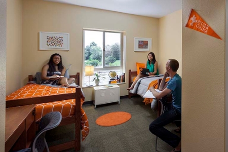 Students socializing in a dorm room at Pitzer College
