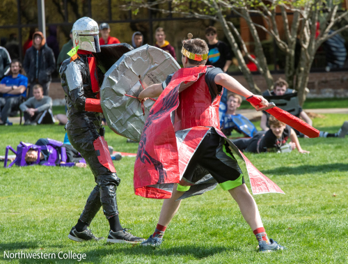 Students at Northwestern College playing live action role playing games outdoors